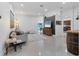 Spacious living room with tile floors, modern decor and lots of natural light at 7135 Royal George Ct, Wesley Chapel, FL 33545