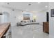 Open-concept living room with tile flooring, comfortable seating, and stylish decor at 7135 Royal George Ct, Wesley Chapel, FL 33545