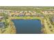 Aerial view of the backyard, showing a scenic lake view and community landscape at 7213 Whittlebury Trl, Lakewood Ranch, FL 34202