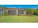Beautiful backyard of this home featuring a screened lanai and lush green lawn at 7213 Whittlebury Trl, Lakewood Ranch, FL 34202