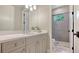 Bright bathroom features a white vanity, sleek fixtures, and modern shower with a glass door at 7213 Whittlebury Trl, Lakewood Ranch, FL 34202