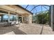 Wide view of covered patio with outdoor dining area and summer kitchen perfect for entertaining at 7213 Whittlebury Trl, Lakewood Ranch, FL 34202