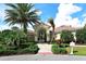 Inviting entrance to a community clubhouse with well-maintained landscaping and a decorative archway at 7213 Whittlebury Trl, Lakewood Ranch, FL 34202