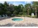 Enjoy this hot tub with lounge chairs, in an outdoor area with tropical landscaping, perfect for relaxation at 7213 Whittlebury Trl, Lakewood Ranch, FL 34202