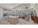 Bright open-concept floorplan featuring island kitchen, dining, and living room with water views at 7213 Whittlebury Trl, Lakewood Ranch, FL 34202