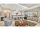 Spacious living room showcasing tile floors, island seating and adjacent dining area at 7213 Whittlebury Trl, Lakewood Ranch, FL 34202