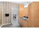 Modern bathroom features sleek vanity, a glass-enclosed shower, and a walk-in closet for ample storage at 7317 Emma Rd, Bradenton, FL 34209
