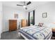 Cozy bedroom features a comfortable bed, ample natural light, and classic wooden furniture with storage space at 7317 Emma Rd, Bradenton, FL 34209