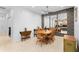 Bright dining room features a ceiling fan and decorative wallpaper in a well-lit space with a table and chairs at 7317 Emma Rd, Bradenton, FL 34209