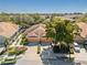 Aerial view of charming home with driveway, well-manicured landscaping, and a two-car garage at 7317 Emma Rd, Bradenton, FL 34209