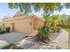 Well-maintained exterior of a single-Gathering home with a two-car garage and lush landscaping at 7317 Emma Rd, Bradenton, FL 34209