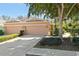 Charming single-Gathering home with a two-car garage and beautifully landscaped front yard with mature tree at 7317 Emma Rd, Bradenton, FL 34209