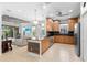 Spacious kitchen featuring an island, modern appliances, and an open floor plan at 7317 Emma Rd, Bradenton, FL 34209