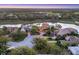 Residential neighborhood features luxury homes around a golf course and lake at 7327 Greystone St, Lakewood Ranch, FL 34202