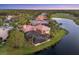 Waterfront property boasts a screened lanai with pool overlooking a golf course at 7327 Greystone St, Lakewood Ranch, FL 34202