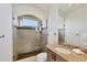 Spa-like bathroom with granite countertops and shower with glass enclosure at 7327 Greystone St, Lakewood Ranch, FL 34202