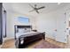 Modern bedroom with hardwood flooring and a beautiful window to let in natural light at 7327 Greystone St, Lakewood Ranch, FL 34202