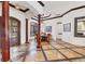Formal dining room featuring custom floors, decorative columns, and a large window with natural light at 7327 Greystone St, Lakewood Ranch, FL 34202