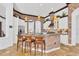 Gourmet kitchen featuring brick accents, modern appliances, and a breakfast bar with seating at 7327 Greystone St, Lakewood Ranch, FL 34202