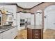 Gourmet kitchen featuring white cabinets, stainless steel appliances, and a center island with granite countertop at 7327 Greystone St, Lakewood Ranch, FL 34202