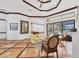 Elegant living room featuring tile flooring, a ceiling fan, and access to the outdoor living space at 7327 Greystone St, Lakewood Ranch, FL 34202