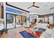 Spacious living room with large windows and sliding doors leading to the patio and pool area at 7327 Greystone St, Lakewood Ranch, FL 34202