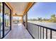 Covered patio with table and chairs provides views of the neighborhood and golf course at 7327 Greystone St, Lakewood Ranch, FL 34202