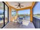 Covered patio with table and chairs provides views of the neighborhood at 7327 Greystone St, Lakewood Ranch, FL 34202