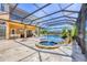 Resort-style pool area with a hot tub, waterfall feature, lounge chairs, and outdoor seating for entertaining at 7327 Greystone St, Lakewood Ranch, FL 34202