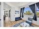 Sitting room with a blue pull out couch and a view of the neighborhood at 7327 Greystone St, Lakewood Ranch, FL 34202