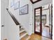 Bright staircase with light wood steps and white walls leading to office with wood floors at 7327 Greystone St, Lakewood Ranch, FL 34202