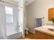 Bathroom with a shower, tub, toilet, and a vanity with a sink and wood cabinets at 7533 Trillium Blvd, Sarasota, FL 34241