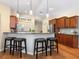 Well-equipped kitchen featuring dark wood cabinetry, stainless steel appliances, and stylish bar seating at the counter at 7533 Trillium Blvd, Sarasota, FL 34241