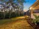Expansive backyard with lush landscaping, mature trees, and a screened-in lanai, perfect for outdoor living at 7533 Trillium Blvd, Sarasota, FL 34241