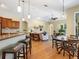 Open concept living space with eat-in kitchen, bar seating, and an inviting living area with stylish furnishings at 7533 Trillium Blvd, Sarasota, FL 34241