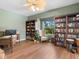 Inviting office with custom wood built-in bookshelves, natural light, and stylish furnishings at 7533 Trillium Blvd, Sarasota, FL 34241
