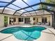 Inviting pool area enclosed with a screen, with easy access to outdoor seating and a dining area at 7533 Trillium Blvd, Sarasota, FL 34241