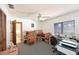 Uncluttered bedroom with printer, blinds, boxes and an open door at 7816 15Th Nw Ave, Bradenton, FL 34209
