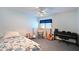 Bedroom featuring a bed, guitar, keyboard and window with blinds at 7816 15Th Nw Ave, Bradenton, FL 34209