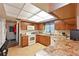 Functional kitchen is equipped with wood cabinetry, granite countertops, modern appliances, and a pass-through to the dining area at 7816 15Th Nw Ave, Bradenton, FL 34209