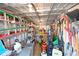 Interior shed featuring ladders, shelving, sprayers and landscaping tools at 7816 15Th Nw Ave, Bradenton, FL 34209