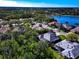 Beautiful aerial view of homes near a scenic lake, offering a tranquil and picturesque neighborhood setting at 8224 Waterview Blvd, Lakewood Ranch, FL 34202