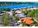 Beautiful aerial view of waterfront homes with lush landscaping and stunning lake views on a sunny day at 8224 Waterview Blvd, Lakewood Ranch, FL 34202