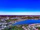 Aerial view of a beautiful neighborhood featuring a large lake and various community amenities at 8224 Waterview Blvd, Lakewood Ranch, FL 34202