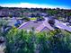 Stunning aerial view showcasing the tile roof of a luxurious home nestled in a lush, tropical landscape at 8224 Waterview Blvd, Lakewood Ranch, FL 34202