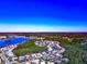 Wide aerial of the homes and landscaping by a large lake at 8224 Waterview Blvd, Lakewood Ranch, FL 34202