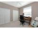 Home office/bedroom with two closets, desk and ceiling fan at 8224 Waterview Blvd, Lakewood Ranch, FL 34202