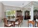 Elegant dining room with wood furniture, decorative details, and natural light at 8224 Waterview Blvd, Lakewood Ranch, FL 34202