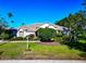 Charming single-story home with mature landscaping, well-manicured lawn, and an inviting front entrance at 8224 Waterview Blvd, Lakewood Ranch, FL 34202