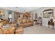 Cozy living room with leather furniture, neutral color palette, and connecting to dining area at 8224 Waterview Blvd, Lakewood Ranch, FL 34202